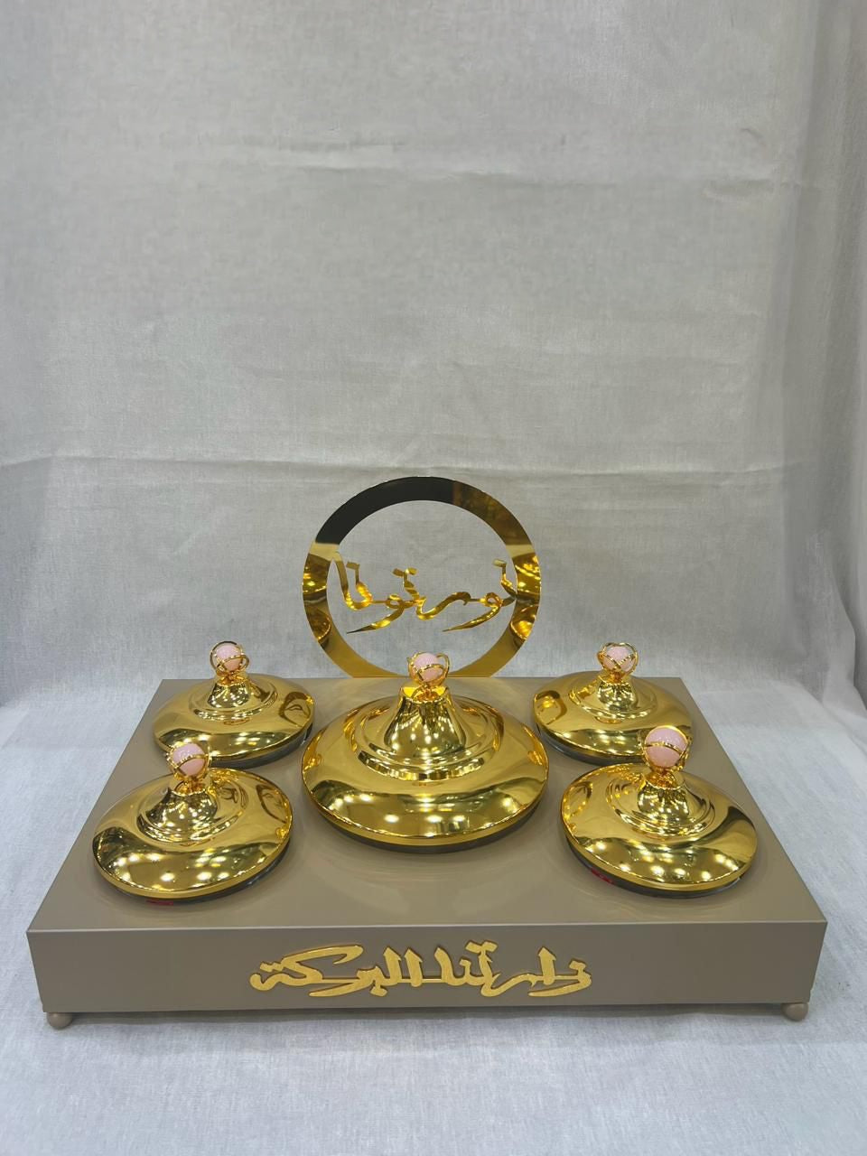 Luxurious Arabic-Inspired Sweet Tray with Gold-Plated Lidded Containers and Elegant Calligraphy