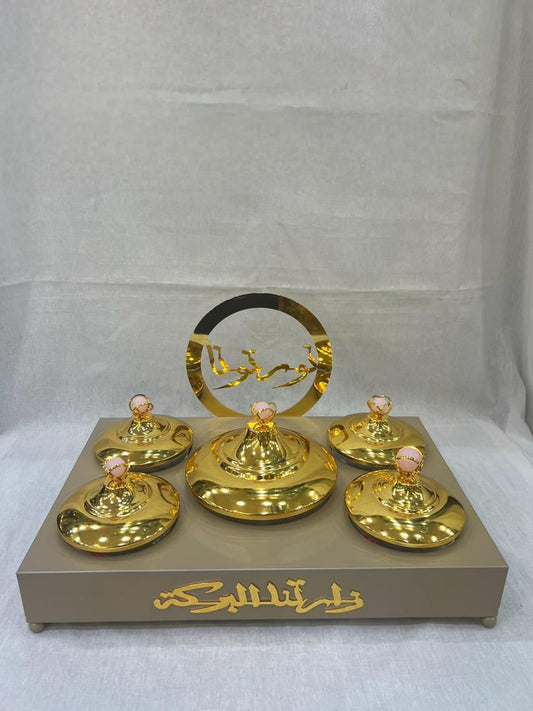 Luxurious Arabic-Inspired Sweet Tray with Gold-Plated Lidded Containers and Elegant Calligraphy