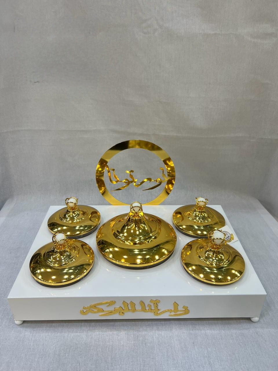 Luxurious Arabic-Inspired Sweet Tray with Gold-Plated Lidded Containers and Elegant Calligraphy